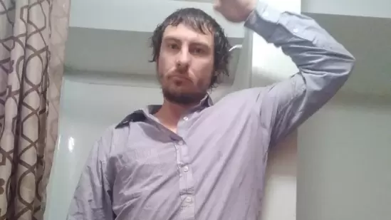 Brandon Lee Buschman had an active arrest warrant and sought refuge inside the freezer to evade law enforcement. (Facebook)