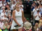 Ukraine's Elina Svitolina celebrates after beating Poland's Iga Swiatek to win their women's singles match on day nine of the Wimbledon tennis championships