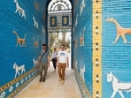 Tourists walk during a tour in the ancient city of Babylon, Iraq. Iraq's ancient sites, vast desert, marshland ecosystems spur new trickle of tourists 