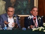 Pakistan's Prime Minister Shehbaz Sharif (R) and Pakistan's Finance Minister Ishaq Dar (L) address a press conference in Lahore. Pakistan's Prime Minister Shehbaz Sharif (R) and Pakistan's Finance Minister Ishaq Dar (L) address a press conference in Lahore.