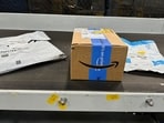 Packages are transported on a conveyor belt at the Amazon warehouse, busy on Prime Day, in Melville, New York, U.S., June 11, 2023. REUTERS/Soren Larson