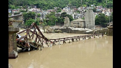 A bridge near Panchvaktra Temple gets damaged due to the rise in the water level of Beas river triggered by heavy rainfall in Mandi on Tuesday. (ANI) A bridge near Panchvaktra Temple gets damaged due to the rise in the water level of Beas river triggered by heavy rainfall in Mandi on Tuesday. (ANI)