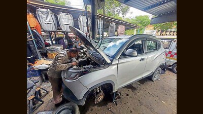 A vehicle damaged during the rain being repaired in Chandigarh on Tuesday. (HT Photo) A vehicle damaged during the rain being repaired in Chandigarh on Tuesday. (HT Photo)