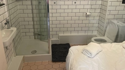 Airbnb guest, David Holtz, received a rental space consisting a bathroom with a bed