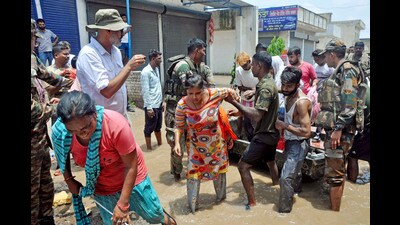 Army personnel rescuing people stuck in the flood-affected Sanauri Adda area after heavy monsoon rains caused rapid rise in the water level of Badi Nadi in Patiala on Tuesday. (ANI Photo) Army personnel rescuing people stuck in the flood-affected Sanauri Adda area after heavy monsoon rains caused rapid rise in the water level of Badi Nadi in Patiala on Tuesday. (ANI Photo)