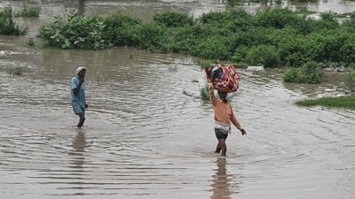 The Yamuna River in Delhi, which was flowing above warning level for hours, crossed the danger mark of 205.33 metres at 5 pm on Monday, the latest data from the flood control department said. (AFP) The Yamuna River in Delhi, which was flowing above warning level for hours, crossed the danger mark of 205.33 metres at 5 pm on Monday, the latest data from the flood control department said. (AFP)