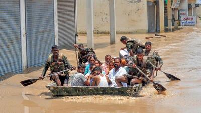 Indian Army personnel rescue people stuck in the flooded Sanauri Adda area after an increase in the water level of Badi Nadi river following heavy monsoon rain, in Patiala, Tuesday (PTI) Indian Army personnel rescue people stuck in the flooded Sanauri Adda area after an increase in the water level of Badi Nadi river following heavy monsoon rain, in Patiala, Tuesday (PTI)