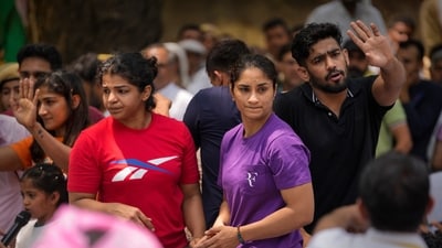 Wrestlers Vinesh Phogat and Sakshi Malik with supporters during their protest against Wrestling Federation of India (WFI) chief Brij Bhushan Sharan Singh. (PTI)