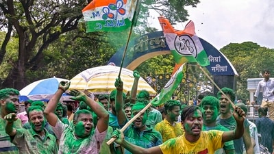 TMC workers and supporters celebrate the party's lead during the counting of votes of the West Bengal panchayat polls, in Nadia district on Tuesday. (PTI)