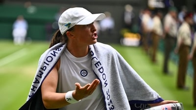 Poland's Iga Swiatek speaks to her team after loosing her first set against Ukraine's Elina Svitolina during their women's singles quarter-finals tennis match on the ninth day of the 2023 Wimbledon Championships (AFP) Poland's Iga Swiatek speaks to her team after loosing her first set against Ukraine's Elina Svitolina during their women's singles quarter-finals tennis match on the ninth day of the 2023 Wimbledon Championships (AFP)