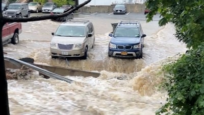 Flooding surrounds a parking lot, in Highland Falls, Orange County, New York. (Reuters)