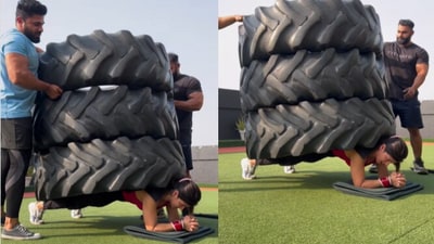 Woman balances 3 truck tyres on her back while doing a plank, (Instagram/@imkavy) Woman balances 3 truck tyres on her back while doing a plank, (Instagram/@imkavy)