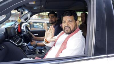 Wrestling Federation of India president Brij Bhushan Sharan Singh leaving his house after a visit by the Special Investigation Team at his New Delhi residence in June (AP File) Wrestling Federation of India president Brij Bhushan Sharan Singh leaving his house after a visit by the Special Investigation Team at his New Delhi residence in June (AP File)