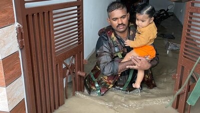 An Indian Army personnel assists in rescue and evacuation in Punjab's Rajpura. (@westerncomd_IA) An Indian Army personnel assists in rescue and evacuation in Punjab's Rajpura. (@westerncomd_IA)