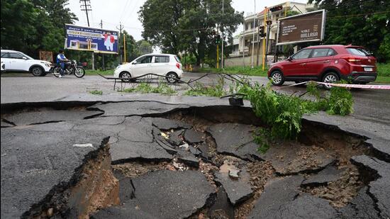 A road cave in seen near Sports Complex, Mohali, after heavy rain on Monday. (Sanjeev Sharma/HT)