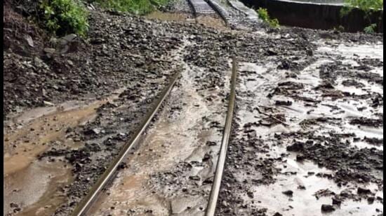 Shimla-Kalka heritage rail track gets covered with mud sludge following heavy rainfall, in Shimla on Sunday. Due to the inclement weather, train movement on this track gets cancelled. (ANI/Representational image)