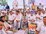 Rajasthan Congress President Govind Singh Dotasra, party's State Incharge Sukhjinder Singh Randhawa, senior leaders Sachin Pilot, Jitendra Singh with party leaders and workers during a silent protest 'Maun Satyagraha' in solidarity with party leader Rahul Gandhi, at Shaheed Smarak, in Jaipur. (PTI) Rajasthan Congress President Govind Singh Dotasra, party's State Incharge Sukhjinder Singh Randhawa, senior leaders Sachin Pilot, Jitendra Singh with party leaders and workers during a silent protest 'Maun Satyagraha' in solidarity with party leader Rahul Gandhi, at Shaheed Smarak, in Jaipur. (PTI)