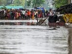People waiting for help at the Yamuna Sabzi Mandi wade through floodwaters near Mayur Vihar on Wednesday. (Raj K Raj/HT Photo) People waiting for help at the Yamuna Sabzi Mandi wade through floodwaters near Mayur Vihar on Wednesday. (Raj K Raj/HT Photo)