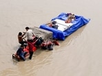 People move to a safe place as flood water levels rise at the banks of Yamuna river, near Mayur Vihar in New Delhi on Wednesday.