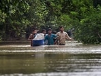 People from low-lying areas around the Yamuna river wade through floodwaters of the swollen river while relocating to a safer place, in New Delhi, Wednesday, July 12, 2023. People from low-lying areas around the Yamuna river wade through floodwaters of the swollen river while relocating to a safer place, in New Delhi, Wednesday, July 12, 2023.