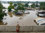Swollen Yamuna river floods low-lying areas after heavy monsoon rain, in New Delhi, Wednesday. The low-lying flood prone areas near the river in Delhi are inhabited by around 41,000 people. Swollen Yamuna river floods low-lying areas after heavy monsoon rain, in New Delhi, Wednesday. The low-lying flood prone areas near the river in Delhi are inhabited by around 41,000 people.