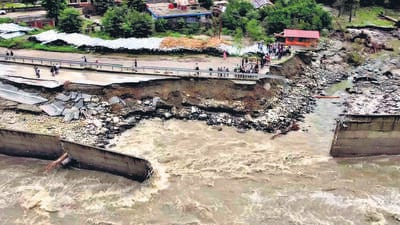 A view of a damaged road in Manali, caused by flooding in view of incessant rains in Himachal Pradesh, on Wednesday. (ANI) A view of a damaged road in Manali, caused by flooding in view of incessant rains in Himachal Pradesh, on Wednesday. (ANI)