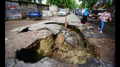 A view of a road that collapsed near Balrampur Hospital due to heavy rain in Lucknow recently. (ANI Photo) A view of a road that collapsed near Balrampur Hospital due to heavy rain in Lucknow recently. (ANI Photo)