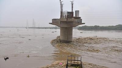 A view of the swollen Yamuna as its water level crosses the danger mark in New Delhi on Wednesday. (ANI) A view of the swollen Yamuna as its water level crosses the danger mark in New Delhi on Wednesday. (ANI)