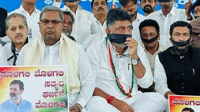 Karnataka CM Siddaramaiah, DCM DK Shivakumar and Congress MLAs observe a 'Silent Satyagraha' in Bengaluru to express solidarity with party leader Rahul Gandhi. (ANI Photo) Karnataka CM Siddaramaiah, DCM DK Shivakumar and Congress MLAs observe a 'Silent Satyagraha' in Bengaluru to express solidarity with party leader Rahul Gandhi. (ANI Photo)