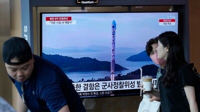 A TV screen shows a file image of North Korea's rocket launch during a news program, at the Seoul Railway Station in Seoul. (AP)