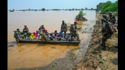 Army personnel rescue residents from a flood-affected area following monsoon rains, in Lohian area of Jalandhar district on Wednesday. (PTI) Army personnel rescue residents from a flood-affected area following monsoon rains, in Lohian area of Jalandhar district on Wednesday. (PTI)