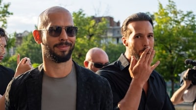 Andrew Tate, left, and his brother Tristan pose with a man outside the Court of Appeal in Bucharest, Romania. (AP) Andrew Tate, left, and his brother Tristan pose with a man outside the Court of Appeal in Bucharest, Romania. (AP)