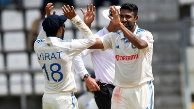 Ravichandran Ashwin and Virat Kohli celebrate the dismissal of Alzarri Joseph (AFP) Ravichandran Ashwin and Virat Kohli celebrate the dismissal of Alzarri Joseph (AFP)