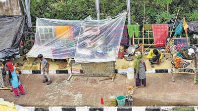 Flood-affected people inside makeshift tents on Wednesday. (PTI) Flood-affected people inside makeshift tents on Wednesday. (PTI)