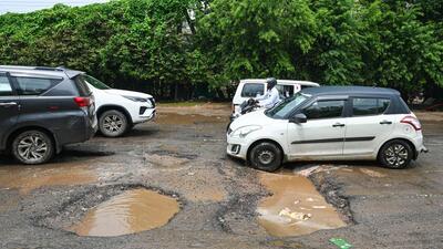 Gurugram, India-July 12, 2023: Due to heavy monsoon rain the road connecting to Hero Honda chowk to Umang Bhardwaj chowk has been badly damaged near Fire station, in Gurugram, India, on Wednesday, 12 July 2023. (Photo by Parveen Kumar/Hindustan Times)(Pic to go with Abhishek Behl's story) Gurugram, India-July 12, 2023: Due to heavy monsoon rain the road connecting to Hero Honda chowk to Umang Bhardwaj chowk has been badly damaged near Fire station, in Gurugram, India, on Wednesday, 12 July 2023. (Photo by Parveen Kumar/Hindustan Times)(Pic to go with Abhishek Behl's story)