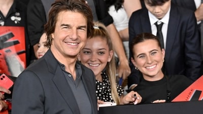 Tom Cruise poses greets fans, poses with them and signs autographs at the premiere of Mission: Impossible - Dead Reckoning Part One. Directed by Christopher McQuarrie, the film released in theatres across the globe on July 12. (Evan Agostini/Invision/AP) Tom Cruise poses greets fans, poses with them and signs autographs at the premiere of Mission: Impossible - Dead Reckoning Part One. Directed by Christopher McQuarrie, the film released in theatres across the globe on July 12. (Evan Agostini/Invision/AP)