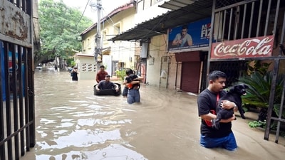 Residents carry their belongings from flooded houses in the Monastery market, near ISBT, in New Delhi, India, on Wednesday, July 12, 2023. (Photo by Sanjeev Verma/ Hindustan Times) Residents carry their belongings from flooded houses in the Monastery market, near ISBT, in New Delhi, India, on Wednesday, July 12, 2023. (Photo by Sanjeev Verma/ Hindustan Times)