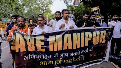 Indian Youth Congress supporters take part in a candle march to pay tribute to those who killed in Manipur violence, at Jantar Mantar in New Delhi. (PTI)