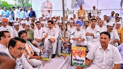 Rajasthan Congress President Govind Singh Dotasra, party's State Incharge Sukhjinder Singh Randhawa, senior leaders Sachin Pilot, Jitendra Singh with party leaders and workers during a silent protest 'Maun Satyagraha' in solidarity with party leader Rahul Gandhi, at Shaheed Smarak, in Jaipur. (PTI) Rajasthan Congress President Govind Singh Dotasra, party's State Incharge Sukhjinder Singh Randhawa, senior leaders Sachin Pilot, Jitendra Singh with party leaders and workers during a silent protest 'Maun Satyagraha' in solidarity with party leader Rahul Gandhi, at Shaheed Smarak, in Jaipur. (PTI)