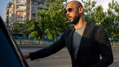 Andrew Tate leaves the Court of Appeal in Bucharest, Romania, Thursday, July 6, 2023. Andrew Tate, the divisive social media personality and former professional kickboxer who is charged in Romania with rape and human trafficking, (AP) Andrew Tate leaves the Court of Appeal in Bucharest, Romania, Thursday, July 6, 2023. Andrew Tate, the divisive social media personality and former professional kickboxer who is charged in Romania with rape and human trafficking, (AP)