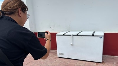 A Thai reporter takes a photo of an empty freezer at the Nong Prue police station in Pattaya, Chonburi province, (AP) A Thai reporter takes a photo of an empty freezer at the Nong Prue police station in Pattaya, Chonburi province, (AP)