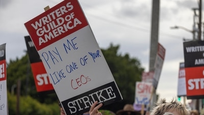 People picket outside of Paramount Pictures studios during the Hollywood writers strike on May 4, 2023 in Los Angeles, California. Scripted TV series, late-night talk shows, film and streaming productions are being interrupted by the Writers Guild of America (WGA) strike. (Getty Images via AFP) People picket outside of Paramount Pictures studios during the Hollywood writers strike on May 4, 2023 in Los Angeles, California. Scripted TV series, late-night talk shows, film and streaming productions are being interrupted by the Writers Guild of America (WGA) strike. (Getty Images via AFP)