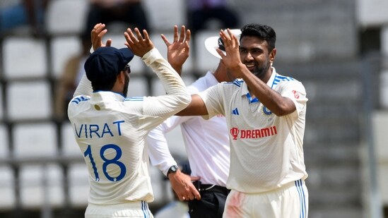 Ravichandran Ashwin (R) and Virat Kohli (L) of India celebrates the dismissal of Alzarri Joseph of West Indies (AFP)