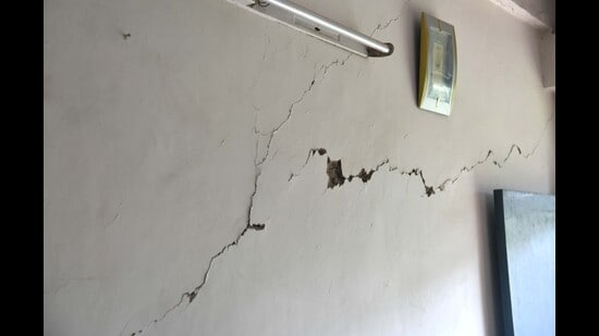 Thick cracks have developed in the building that was constructed in 1976 and is used by around 55 employees. (Keshav Singh/HT)