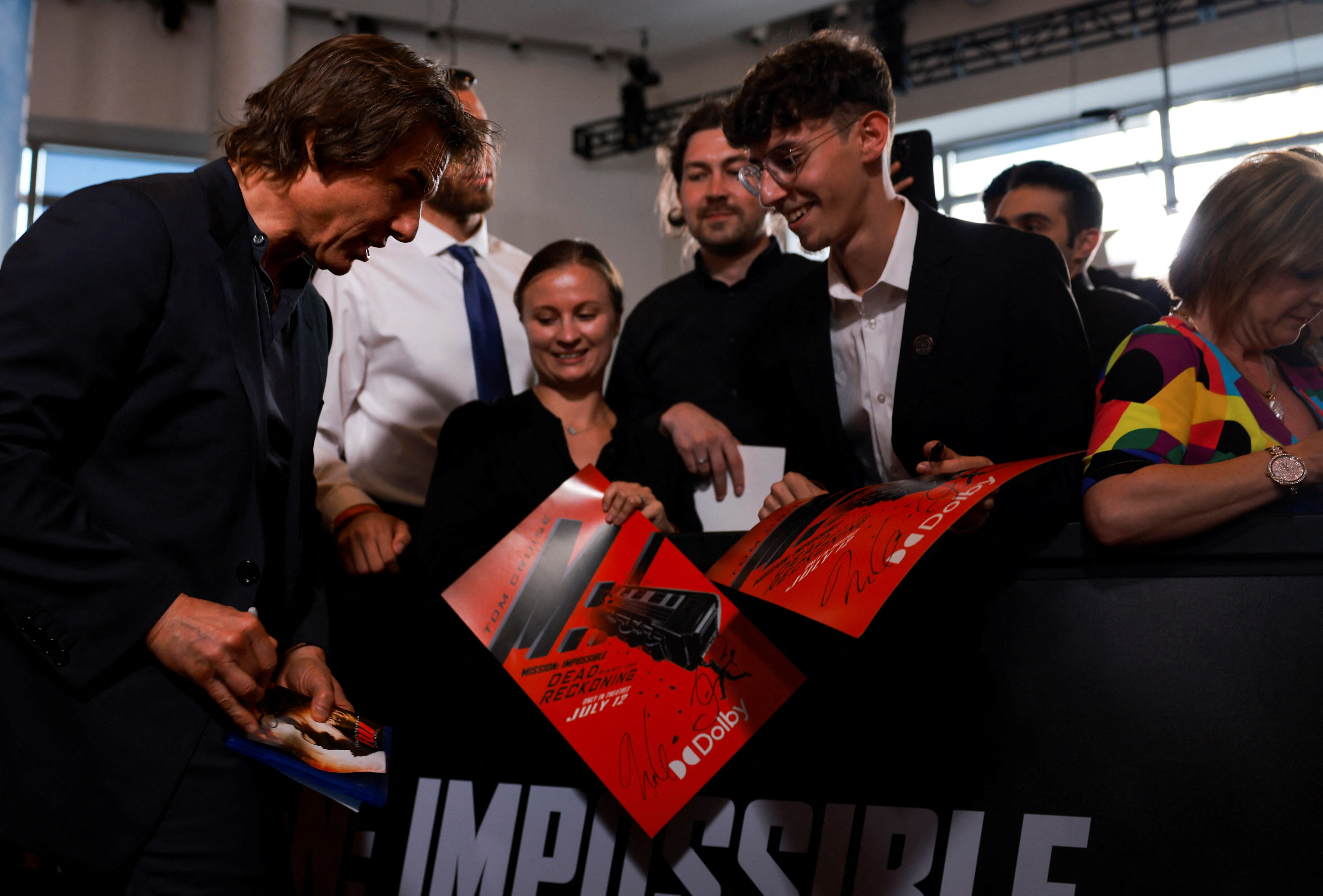 Cast member Tom Cruise signs autographs during the premiere of the film "Mission: Impossible - Dead Reckoning Part One," in New York City, New York, U.S., July 10, 2023. REUTERS/Amr Alfiky (REUTERS)