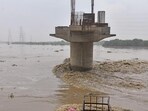 A view of the swollen Yamuna as its water level crosses the danger mark in New Delhi on Wednesday. (ANI) A view of the swollen Yamuna as its water level crosses the danger mark in New Delhi on Wednesday. (ANI)