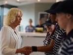 Queen Camilla, left, meets ballboy and ballgirls Larissa, Sean Michael and Cassie as she arrives for her visit on day ten of the 2023 Wimbledon Championships at the All England Lawn Tennis and Croquet Club in London. Queen Camilla, left, meets ballboy and ballgirls Larissa, Sean Michael and Cassie as she arrives for her visit on day ten of the 2023 Wimbledon Championships at the All England Lawn Tennis and Croquet Club in London.