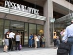 (FILES) People line up outside the US Passport Office in Washington, DC, June 20, 2007. It is an "unprecedented demand", which comes up against the need to "rebuild" a service practically dismantled during covid, US Secretary od State Antony Blinken acknowledged, as travel surges post-Covid. The US State Department asked citizens to "check the expiration date of the document and renew it" as soon as possible before traveling.