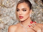Khloé Kardashian shuts down "Kardashian Curse" on reality show, challenging sexist narrative and absolving women from blame in relationships. 