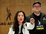 FILE PHOTO: SAG-AFTRA union President Fran Drescher speaks next to Duncan Crabtree-Ireland, SAG-AFTRA National Executive Director and Chief Negotiator, at SAG-AFTRA offices after negotiations ended with the Alliance of Motion Picture and Television Producers (AMPTP), the entity that represents major studios and streamers, including Amazon, Apple, Disney, NBCUniversal, Netflix, Paramount, Sony, and Warner Bros Discovery, triggering an actors’ strike, in Los Angeles, California, U.S., July 13, 2023. REUTERS/Mike Blake/File Photo